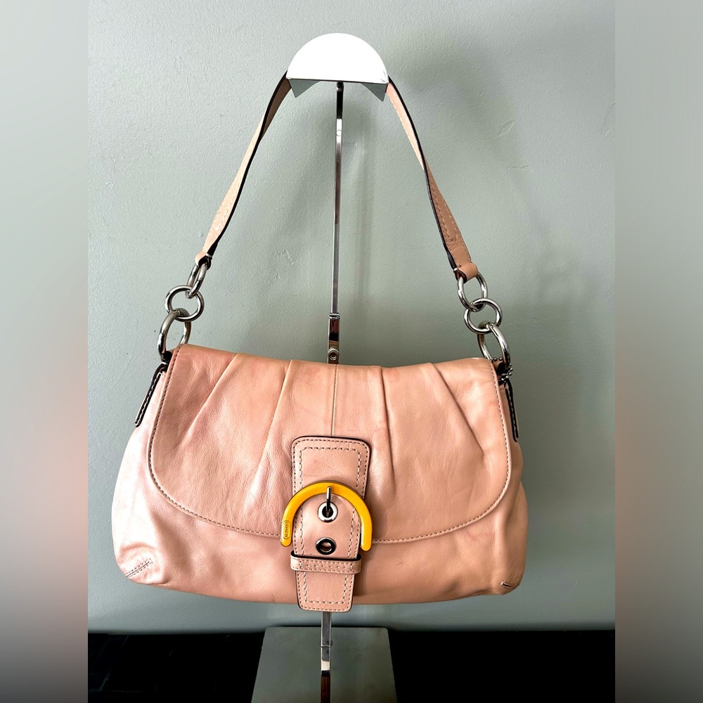 Coach shoulder bag. I never got a chance to use it after purchase.